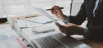 Businessman calculating the financial liquidity of the company