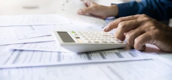 Man using a calculator