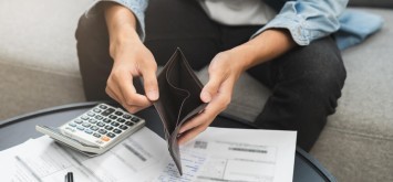 Man with empty wallet