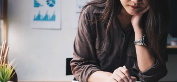 Business woman using a calculator