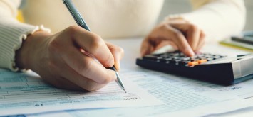 Woman looking at HMRC debts