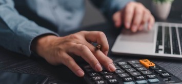 Businessman using a calculator