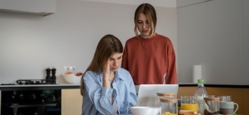 Depressed young woman getting a debt letter