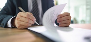 Business man looking at a form