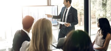 Man, leader and presentation in office for business meeting, discussion for company performance.