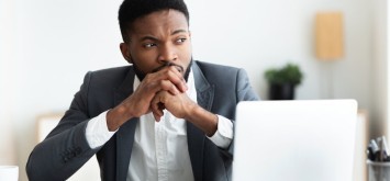 Entrepreneur getting nervous in workplace, unsure in his business strategy.
