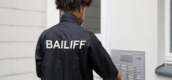 Man Standing At The Entrance Of The House Ringing The Door Bell.
