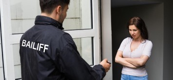 Bailiff Seizure Or Court Arrest Of Young Woman.